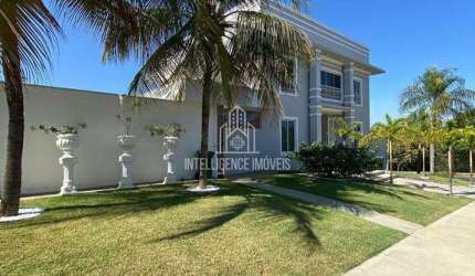 Casa em condomínio à venda com 424m² de área construída, 4 suítes sendo  1 master com amplo closet,