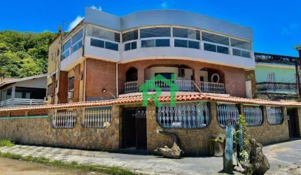 Casa á venda na Praia do Guaiuba | Rocha Imóveis Guarujá