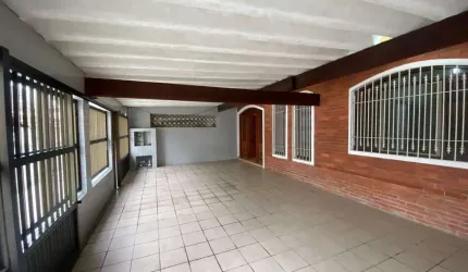 Casa com 3 dormitórios à venda, 120 m² por R$ 650.000,00 - Vila Guilhermina - Praia Grande/SP