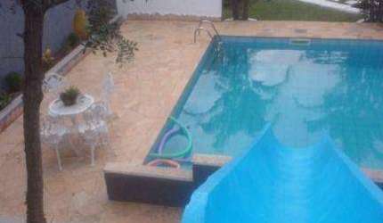 Casa com 3 dormitórios à venda, 191 m² por R$ 1.400.000,00 - Condomínio Reserva Ibirapitanga - Santa Isabel/SP