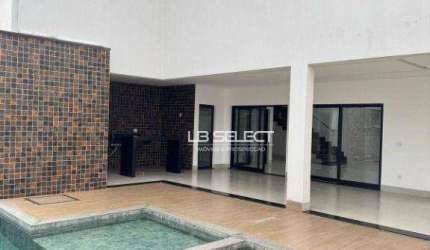 Casa no Condomínio Gávea Hill II com quatro suítes e área gourmet completa.