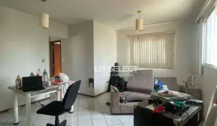 Apartamento com três quartos sendo uma suíte, sala em dois ambientes, banheiro social e garagem para um carro.