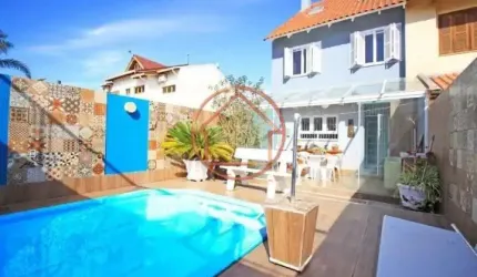 Casa em condomínio fechado com 4 quartos à venda na Rua Antonio Delapieve, 420, Mário Quintana, Porto Alegre por R$ 740.000