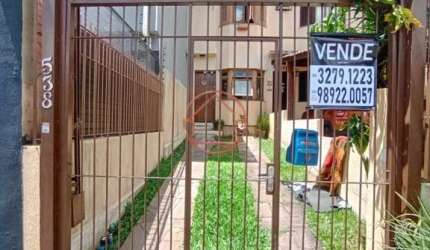 Casa com 2 quartos à venda na Rua Professora Ziláh Totta, 538, Jardim Leopoldina, Porto Alegre por R$ 450.000