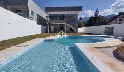 Casa em condomínio fechado com 4 quartos à venda em Horto Florestal, Ubatuba  por R$ 1.390.000