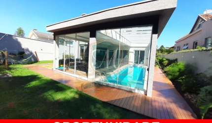 Linda casa tipo sobrado a venda no Alphaville Graciosa em Pinhais, com 550 m², 4 quartos, 5 bh, escritorio, area gourmet com piscina coberta, 3 salas,