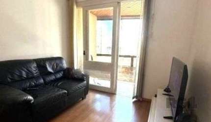 Apartamento no Centro de 1 dormitório, sacada e vaga