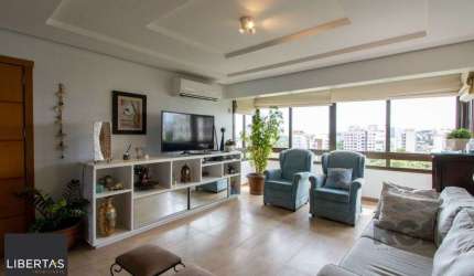 Apartamento possui 3 dormitórios, sendo 1 suíte, semi-mobiliado, com 107,27m² de área privativa, living para 2 ambientes, espaço gourmet com churrasqueira, cozinha com área de serviço; 2 vagas simples