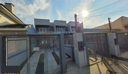 Sobrado com 3 dormitórios, suíte e duas vagas de garagem no bairro Sarandi