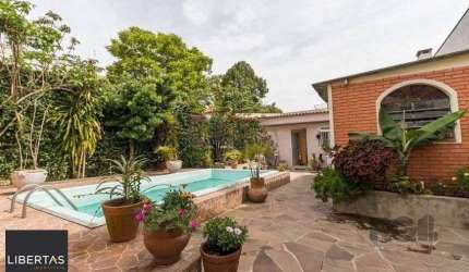 CASA PRÓXIMA AO PONTAL, com 5 vagas, 3 dormitórios!