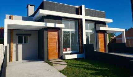 CASA COM 2 DORMITORIOS, SENDO 1 SUITE BEM LOCALIZADO!