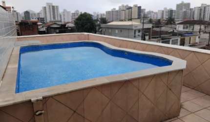 Casa com 3 quartos, piscina e área gourmet em Praia Grande.