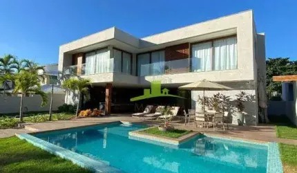 Casa à venda no Condomínio Paraíso, Guarajuba, 303m², 7 suítes, piscina, área gourmet, a 20m da praia, Porteira Fechada. Agende sua visita!