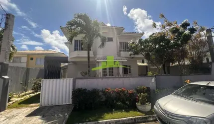 Casa à venda em Lauro de Freitas: 3 suítes, área gourmet, gabinete e 3 vagas. Condomínio Vilas do Bosque com lazer completo. Agende sua visita!