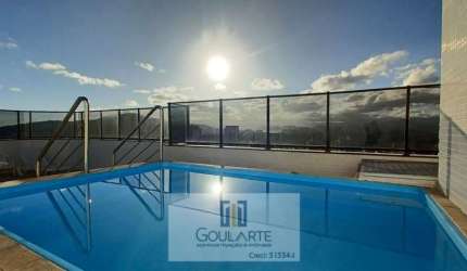 Apartamento alto padrão com acesso a sacada, 2 suítes e lazer no condomínio, na praia das Astúrias - Guarujá/SP.