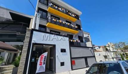 Apartamento à venda, de 55,99m², com 2 dormitórios, sala, cozinha, banheiro e sacada.