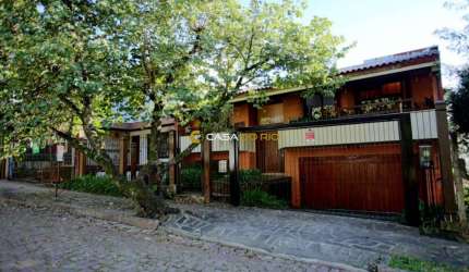 Casa com 4 quartos à venda na Rua Alcebíades Antônio dos Santos, 157, Nonoai, Porto Alegre por R$ 1.650.000