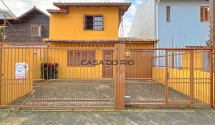 Casa com 3 quartos à venda na Rua Giobatta Giuseppe Petracco, 220, Vila Nova, Porto Alegre por R$ 475.000
