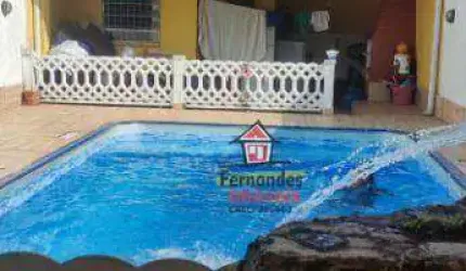 Casa térrea com piscina mais edícula , com 2 dormitórios à venda, 129 m² por R$ 720.000 - Caiçara - Praia Grande/SP