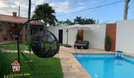 Casa isolada com piscina e espaço gourmet  3 dormitórios mais dependência à venda, 220 m² por R$ 1.300.000  Balneário Flórida  Praia Grande SP