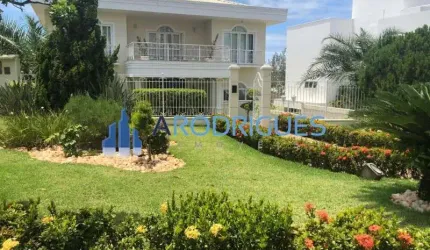 Casa luxuosa em condomínio de alto padrão em Piatã, Salvador-BA: 5 quartos, 5 suítes, 4 salas, 7 banheiros, 5 vagas, 1.025m². Venha conferir!