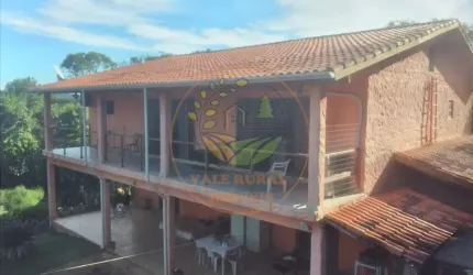 EXCELENTE CHÁCARA EM CONDOMINIO FECHADO COM 11.000 M² NA ZONA NORTE, ESCRITURADA E COM PISCINA!  CH00048