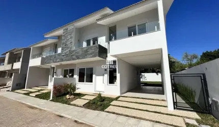 Casa em condomínio fechado com 3 dormitórios, suíte e 2 vagas de garagem