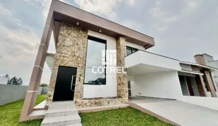 Casa para venda 3 dormitórios sendo suítes, 2 vagas de garagem situada no Bairro