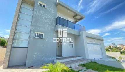 Casa à Venda 3 dormitórios, 1 suíte, lareira, 2 vagas de garagem, situada no bai