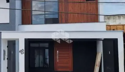 CASA GEMINADA A VENDA 3 QUARTOS, SENDO 1 SUÍTE - SAGUAÇU