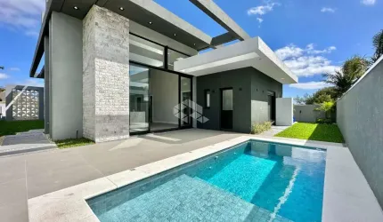Casa à venda com 4 quartos/suítes e 2 vagas/box em Atlântida, Xangri-Lá/RS