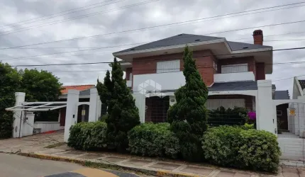 Sobrado à venda, com 4 quartos/dormitórios, 2 vagas/box, em Atlântida, Xangri-Lá/RS