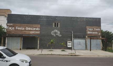 Terreno com prédio comercial e casa construídos