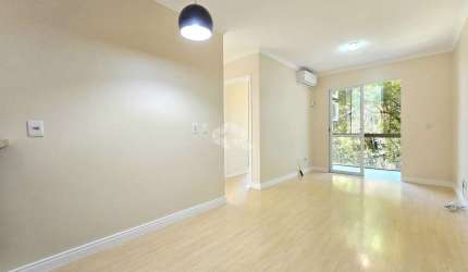 Apartamento com 2 Dormitórios/Quartos , living para 2 ambientes e uma sacada com churrasqueira, 1 vaga de garagem coberta no bairro Marechal Rondon