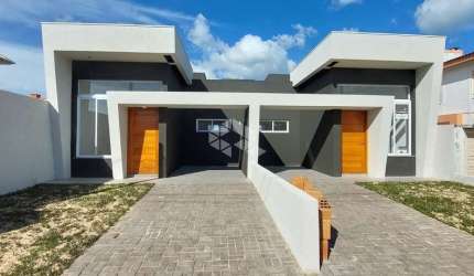 Casa geminada com 3 dormitórios/quartos e 2 vagas em Capão Da Canoa/Rs