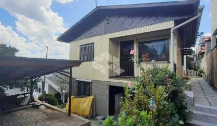 02 CASAS DE MADEIRA SOB 01 TERRENO DE 360M² NO SÃO CAETANO EM CAXIAS DO SUL