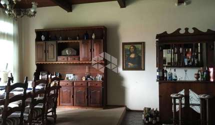 Crédito Real vende CASA de 4 quartos (2 suítes) e 3 vagas de garagem no centro de Viamão - RS.