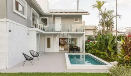 Casa residencial semimobiliada com 5 suítes, 2 vagas de garagem - Jurerê - Floripa/SC