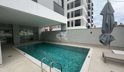 APARTAMENTO MODERNO COM 2 QUARTOS, SENDO 2 SUÍTES, 1 VAGA DE GARAGEM NO BAIRRO BALNEÁRIO EM FLORIANÓPOLIS/SC.