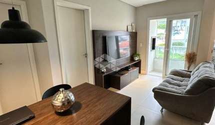 APARTAMENTO SEMIMOBILIADO NO CORREGO GRANDE 1 QUARTO 2 VAGAS E SACADA COM CHURRASQUEIRA