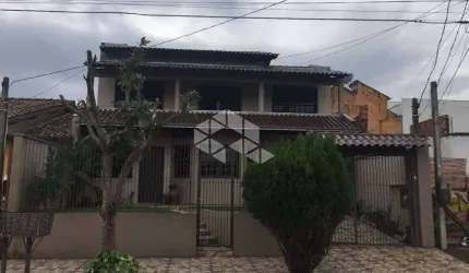 Casa 4 dormitórios sendo uma suíte e 4 vagas bairro Monhos de Vento, Canoas/RS.
