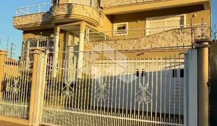 Sobrado 3 pavimentos, semimobiliado, 4 dormitórios, sendo 2 suítes, 4 vagas de garagem. Canoas