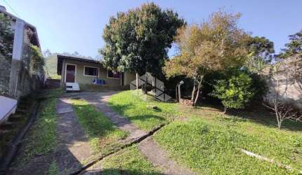 Terreno com 3 casas em Estância Velha
