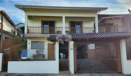 Casa a venda no bairro Primavera em Novo Hamburgo/RS, 3 dormitórios sendo 1 suíte, Aceita financiamento bancário.