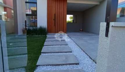 CASA À VENDA TÉEREA - 2 DORMITÓRIOS,  SENDO 1 SUITE COM GARAGEM