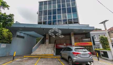 Sala comercial de 227m² privativos em prédio com elevador e portaria.