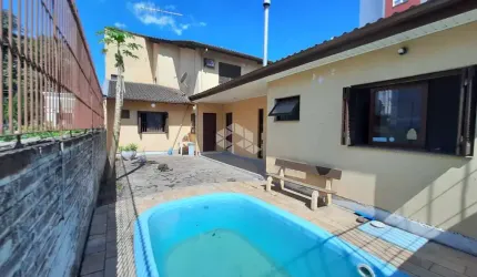 Casa ampla 4 dormitórios, suíte, 4 banheiros, piscina, 4 vagas, bairro Operário, Novo Hamburgo. Aceita financiamento e FGTS.