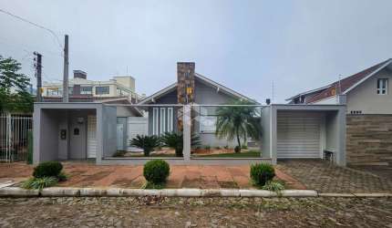 Casa moderna, ampla, com 3 suítes, área gourmet completa, piscina e 4 vagas cobertas no bairro Rio Branco - Novo Hamburgo.