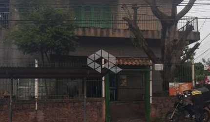 Prédio misto comercial/residencial com 2 apartamentos de 2 dormitórios