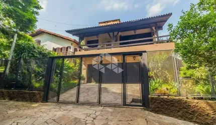 Casa 7 dorms à venda Rua Edgar Luiz Schneider, Jardim Isabel - Porto Alegre